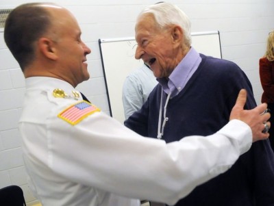 Capt. Steven Ayers greets Bob Clemen. (Reprinted with permission of St. Paul Pioneer Press)