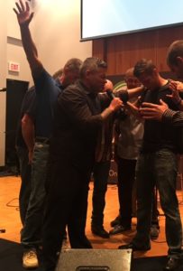 Members of CityReach Church pray over Ethan Barnett