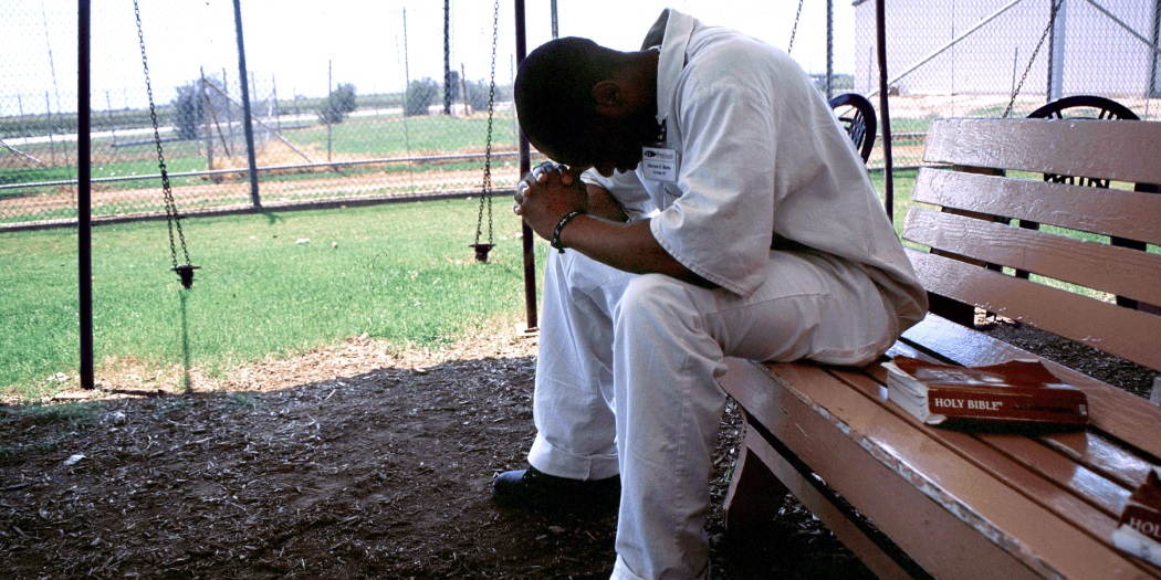 Prisoner praying feature