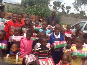 Silwamba poses with children of prisoners