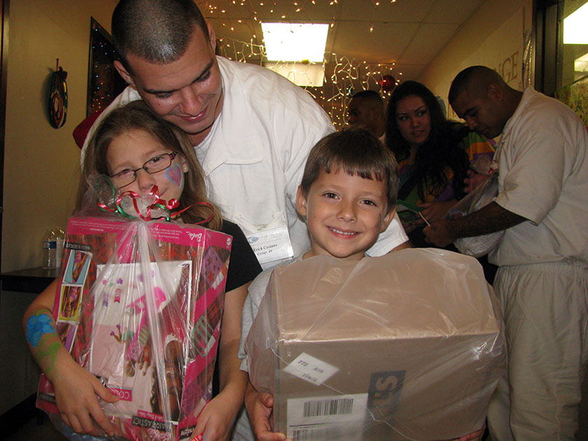 angel tree kids with dad at prison event