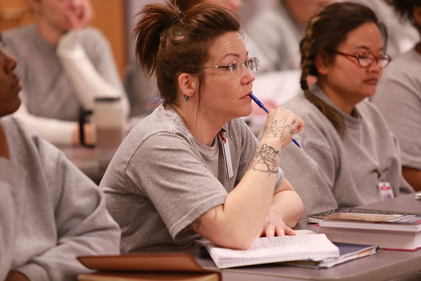 Prison Fellowship Academy participant listens in class