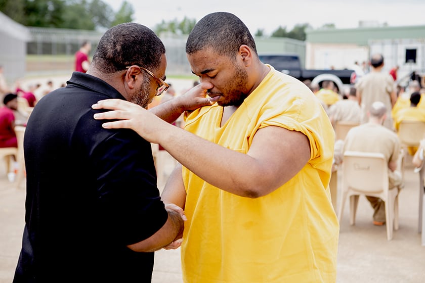 man prays with prisoner at carol s vance unit in houston texas