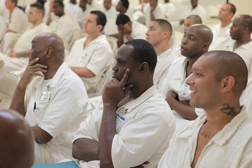 prisoner listens during a prison fellowship class