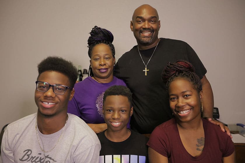 smiling black family of 5