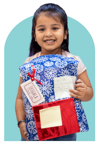 Angel Tree child with Christmas gifts